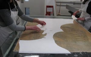 Fig.2. Removal of secondary paper backings after immersion in water