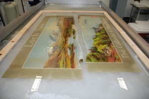 Fig.3. A heavily damaged poster resting on the Reemay® screen during washing Fig.3. A heavily damaged poster resting on the Reemay® screen during washing