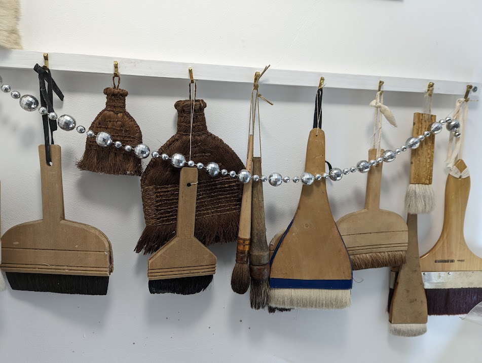 Codex Conservation brushes with festive garland.