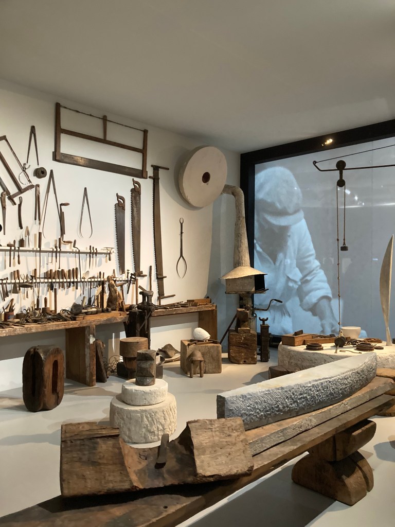 Inside Brancusi's studio with sculptures and tools and video showing the making process