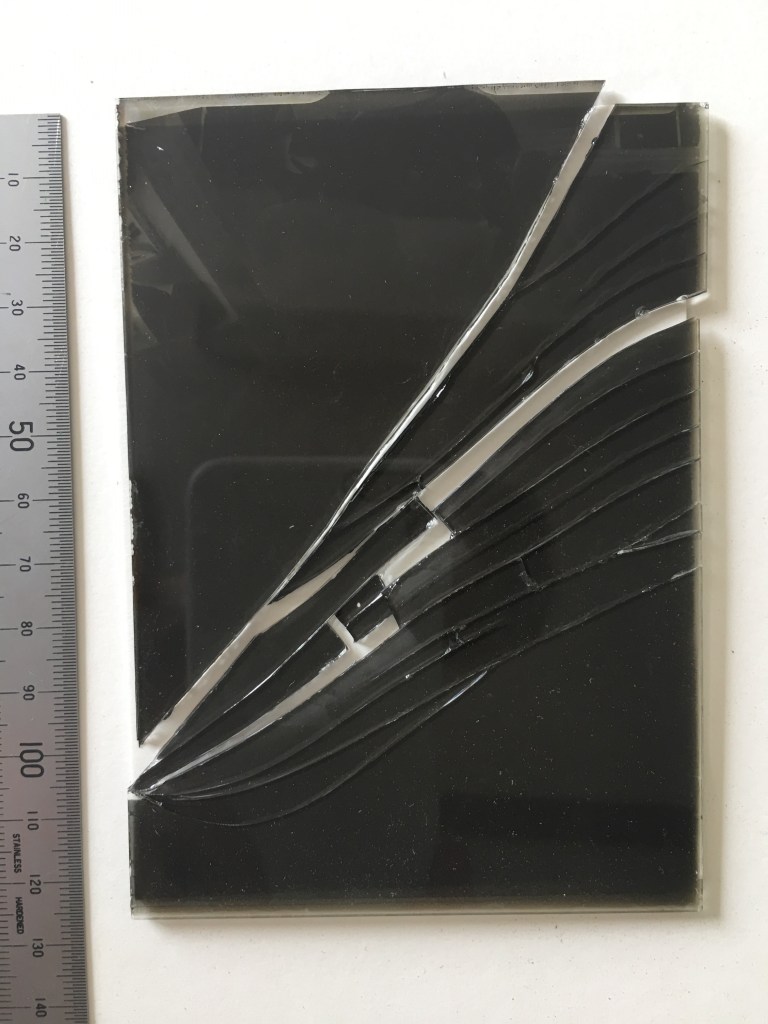 Glass Plate negative with multiple breaks. Bedfordshire Archives BTNeg 2893A/1 11th Nov 1947, before treatment. Photo by Alison Faden.